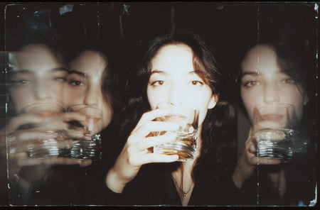 A luxurious display of premium Brandy and Cognac bottles side-by-side, illustrating the main difference between the two classic spirits.